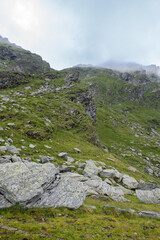 Rocky mountain landscape in the Fagaras Mountains, Romania. Hiking trail and alpine scenery in summer.
