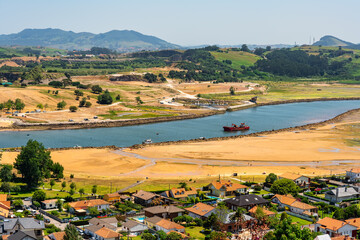 A sea that juts inland and joins the mouth of the Saja River, Cantabria