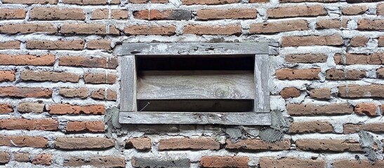 Rustic Brick Wall with Old Wooden Window Frame