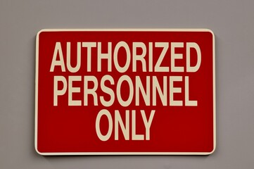 Authorized Personnel Only safety sign warning notice on wall industrial occupation.