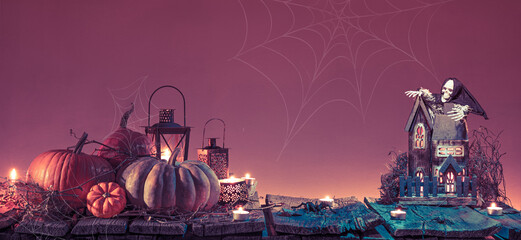 creepy halloween background, pumpkins with skeleton in graveyard at night on wooden board