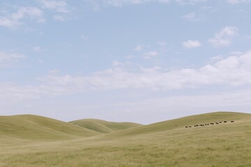 Obraz premium Serene open landscape with rolling green hills under a partly cloudy sky in natural scenery.