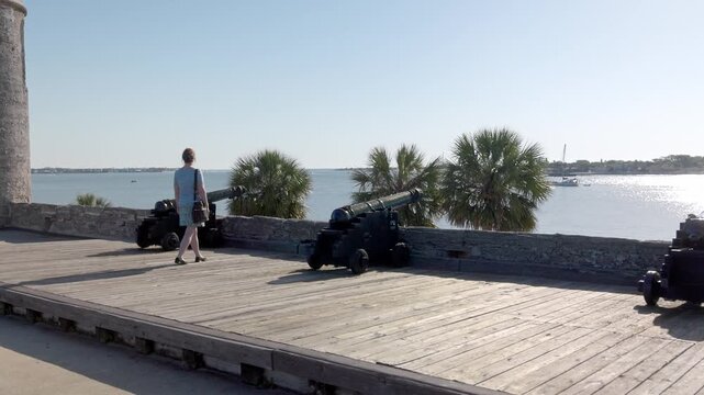 Woman exploring Castillo de San Marcos National Monument in St. Augustine, Florida with gimbal video slow motion.