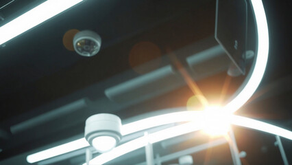 Security and technology showcase surveillance cameras integrated with modern lighting and industrial design highlighting safety and monitoring solutions.