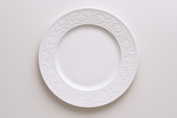 Elegant white decorative plate with intricate embossed floral pattern circular design.