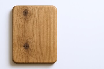 Fototapeta premium Wooden Cutting Board with Smooth Surface and Rounded Edges for Kitchen Use.