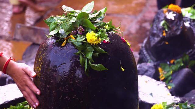 Shiva Lingam Decorated with Bel Patra and Flowers &ndash; Pooja Offering