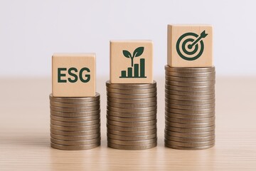 Eco sustainability environmental social governance goal achievement concept with wooden blocks and stacked coins.