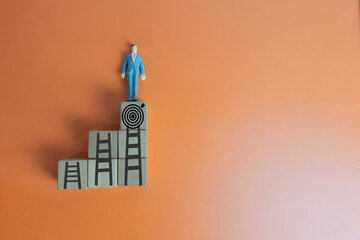 Career growth and advancement concept. A businessman climbing a ladder of success to reach the top....