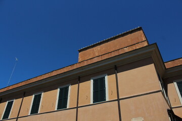 Cozy old street in Trastevere in Rome, Italy. Trastevere is rione of Rome, on the west bank of the Tiber in Rome, Lazio, Italy. Architecture and landmark of Rome Traditional ¨Rome buildings and houses