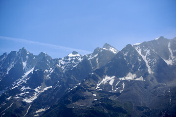 Naklejka premium Scenic view of mountain panorama with mountain peaks at Lötschental Valley in the Swiss Alps on a sunny late spring day. Photo taken June 19th, 2025, Lötschental, Switzerland.