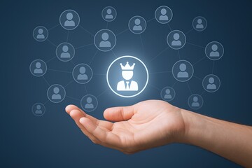 Business man icon on virtual network screen in hand with digital social media icons.