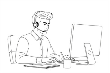 Man wearing headset and typing on computer keyboard at desk