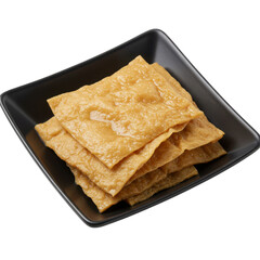 Fototapeta premium Stacked Crispy Tofu Pieces on a Dark Plate