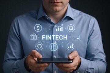 Businessman Using Smartphone with Fintech and Financial Technology Icons Overlay.