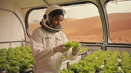 Astronaut cultivates lettuce in Martian greenhouse - Powered by Adobe