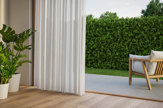 Living room with wood-framed glass doors open to garden. Modern house interior 3d rendering.