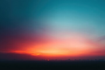 Fototapeta premium Vibrant sunset hues blend into a twilight sky