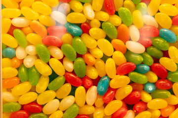 A colorful assortment of jelly beans in various bright shades.