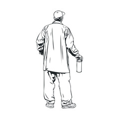Creative man holding paint can while standing outdoors in urban area