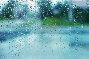 abstract texture of raindrops close up. drops water on wet glass window background in rainy day....