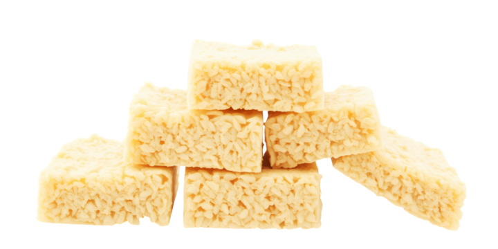 A close up view of a stacked pile of rice cereal treats on a black background on transparent background