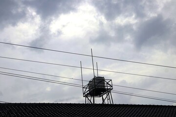 A gloomy atmosphere with overcast skies and thick clouds. The dark sky before the rain, with a...