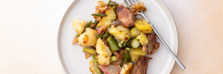 Stewed duck fillet with potatoes and asparagus and radishes, mixed salad of various greens, baked carrots in tahini sauce