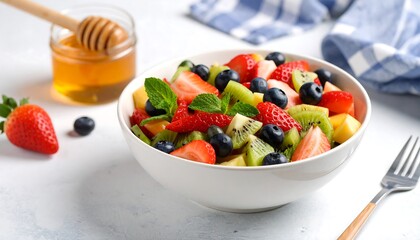 Colorful fruit salad in a white bowl