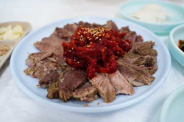 Korean Boiled Beef Slices with Spicy Pollock Salad and Sesame Seeds