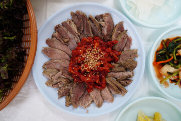 Korean Boiled Beef Slices with Spicy Pollock Salad and Sesame Seeds
