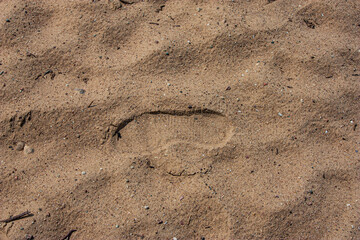 Human footprints on a sandy beach. Sand. The footprints were imprinted in the wet sand