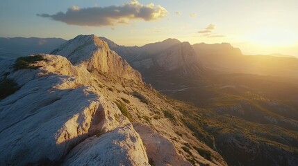 Obraz premium Hiking Rocky Mountain Ridge at Sunset with Golden Light and Landscape