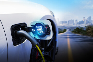 Power cable pump plug in charging power to electric vehicle EV car.