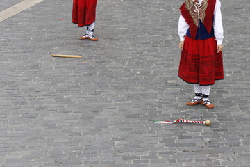 Young women dancing wearing the traditional basque dress
