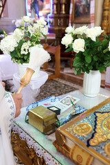 A box with church supplies for the baptism ceremony.