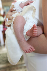 Newborn baby's feet on a canvas. Newborn baptism ceremony.