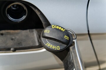 Fuel Cap with Diesel Label on Silver Car
