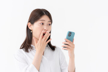 女性　スマートフォン　スマホ　驚く