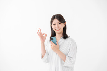 Fototapeta premium 女性 スマートフォン スマホ OK