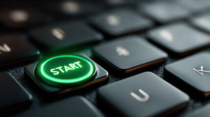 Close Up of Illuminated Green Start Button on Black Keyboard