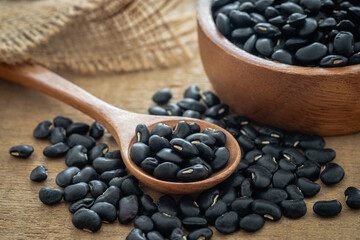 Black bean on wooden spoon