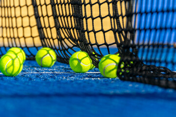 Padel Court Scene with Balls Resting by the Net