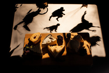 Animal shadow puppets projected onto a lit backdrop, creating a playful and nostalgic atmosphere. A charming visual for childhood, storytelling, or educational themes.