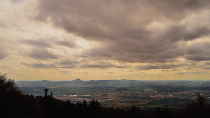 Obraz premium Dark Cloudy Sky Sunshine Looming Over Rolling Czech Hills