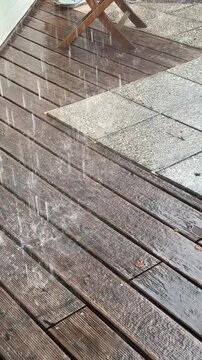 heavy rain pattering on terrace tiles
