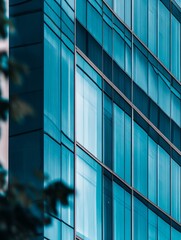 Reflective windows on steel frame, evening light casts patterned reflections.
