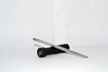 Elegant Nail Tool: A minimalistic composition featuring a delicate nail tool, its refined form and...
