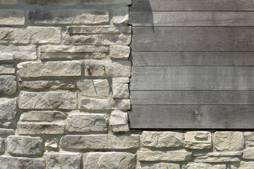 stone and wood plank wall with scribing (fitting wood precisely to irregular curves and contours of...