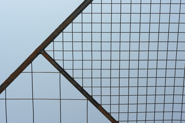 abstract welded wire mesh trellis or garden arch with a distinct geometric, grid-like, appearance